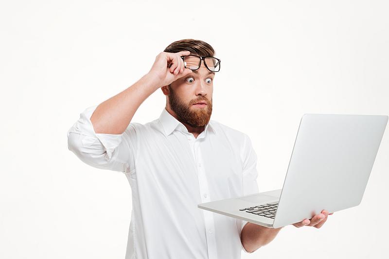 Man raising his glasses